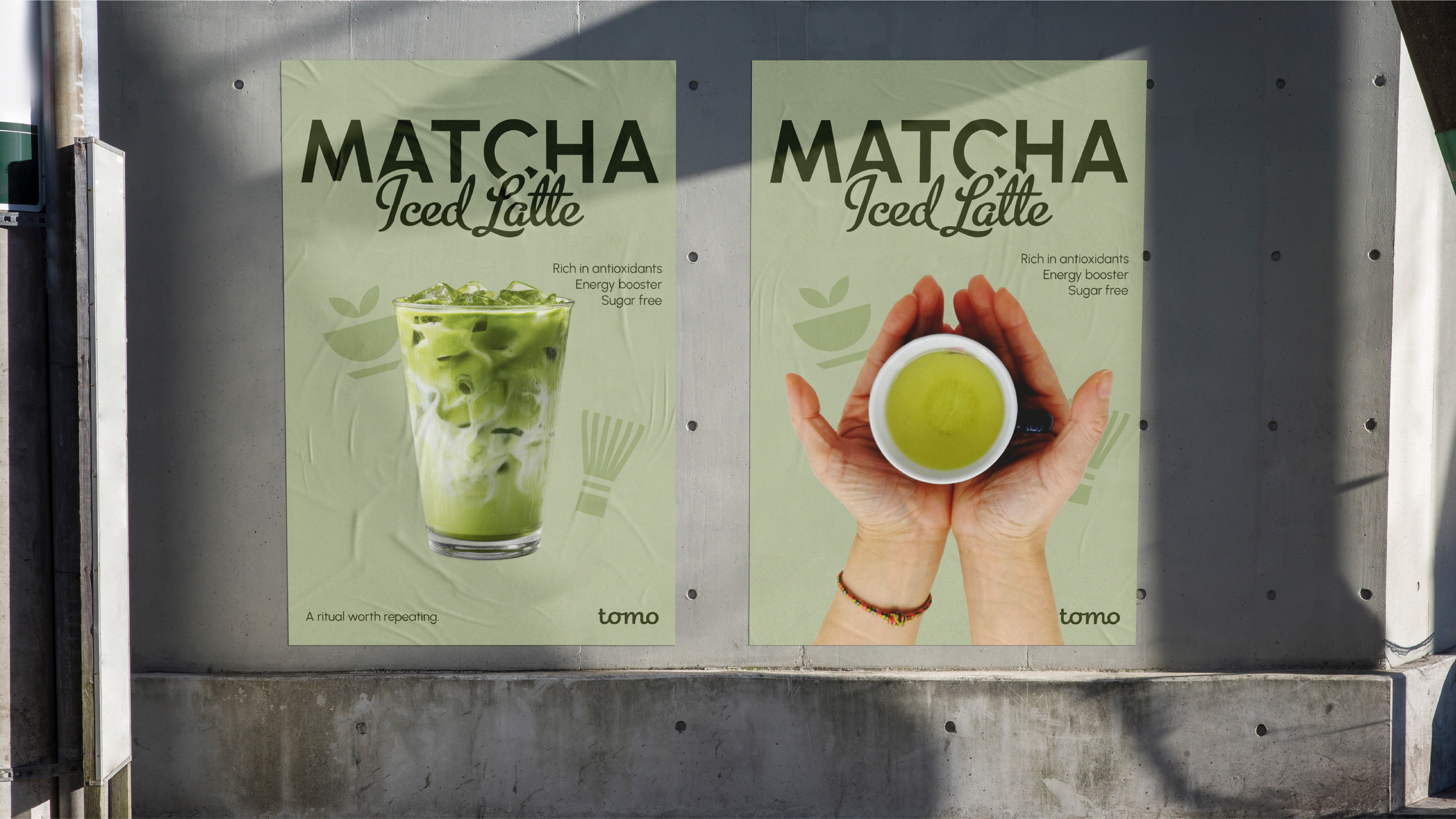 Tomo Matcha Iced Latte posters pasted on concrete wall